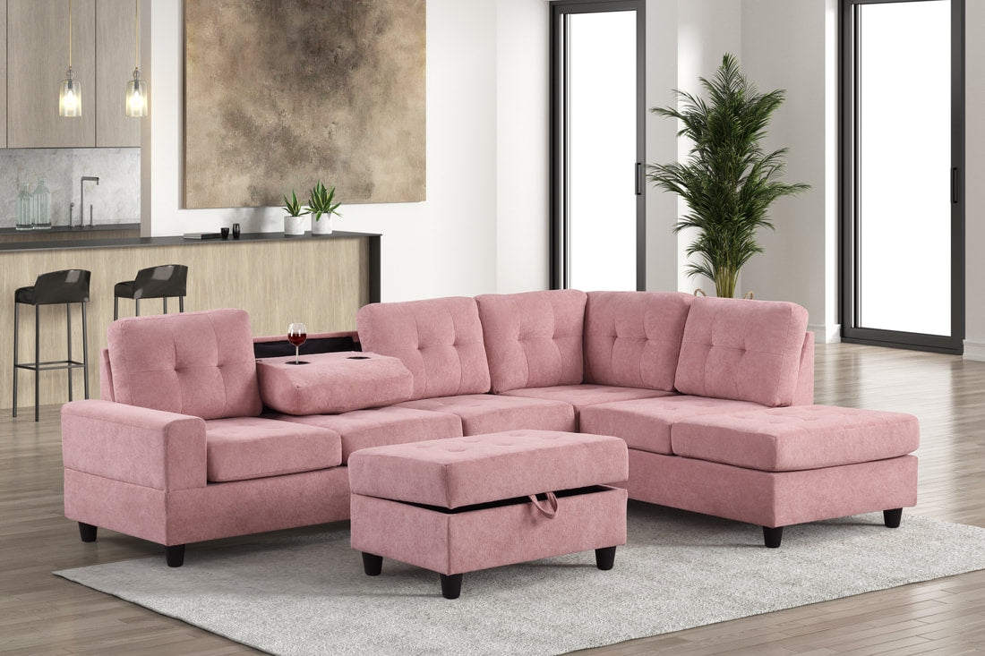 Pink velvet reversible tufted sectional with drop down cup holders and storage ottoman