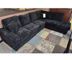 Black corduroy reversible sectional with drop down cup holders and optional storage ottoman