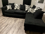 Black Sectional includes throw pillows