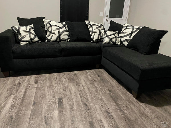 Black Sectional includes throw pillows