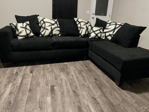 Black Sectional includes throw pillows