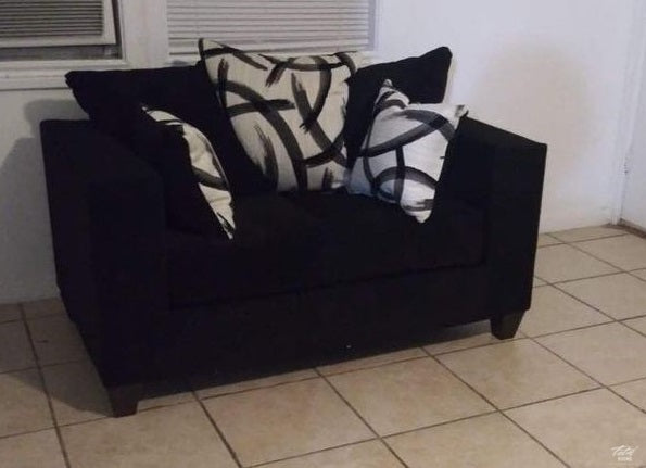 Black sofa and love seat with decorative pillows- new