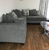 Charcoal Sectional includes throw pillows