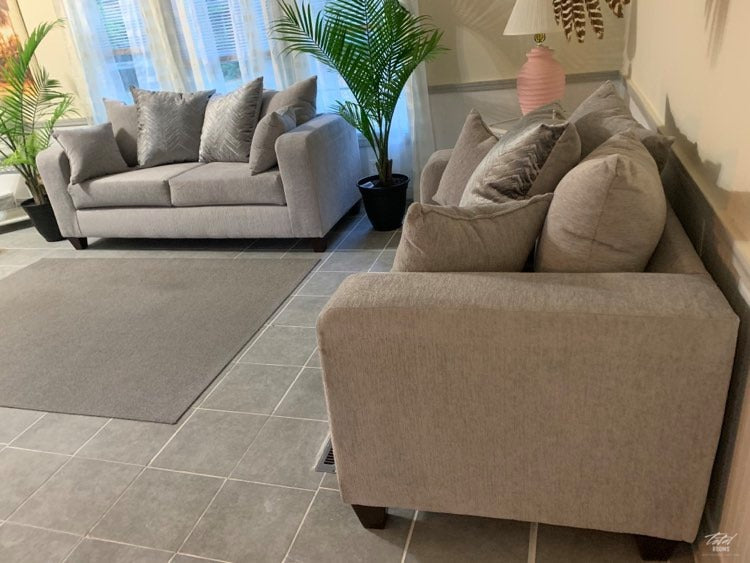 Dove grey sofa and love seat with decorative pillows- new