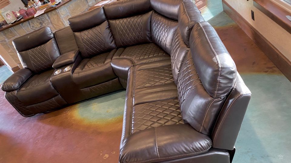 Soft brown leather reclining sectional with cup holders